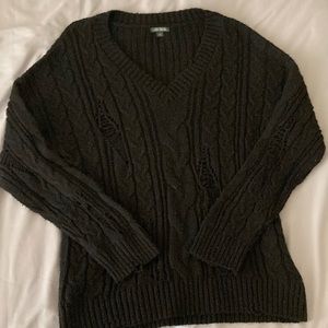 Distressed cable knit sweater